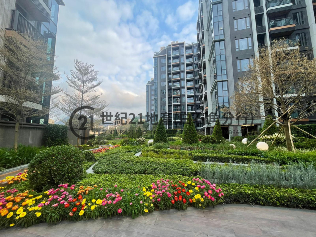 a garden with flowers in front of Silicon Hill building