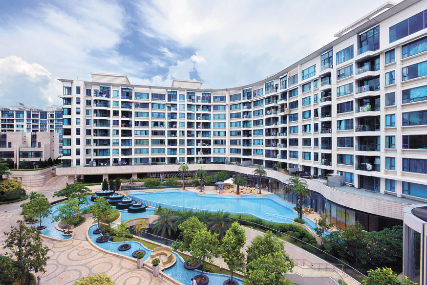 a building with a pool and trees