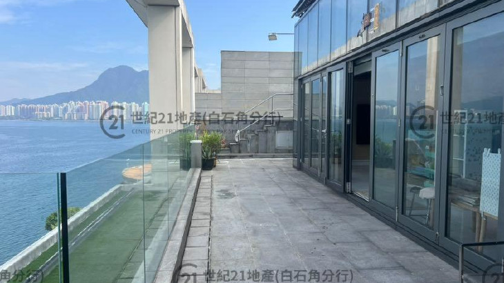 a building with glass walls and a balcony