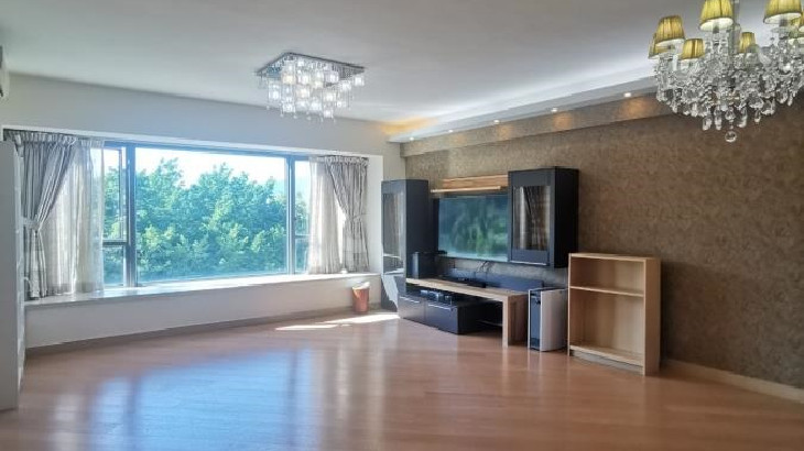 a room with a large window and a television